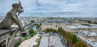 Notre-Dame Cathedral Paris France A rain spout modelled after a Chimera on Notre-Dame rooftop. - Notre-Dame Cathedral Paris France - Travelure ©