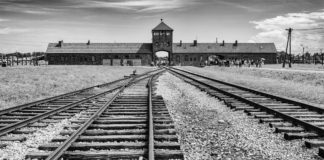 Auschwitz – Homage to the WW-II Holocaust Victims Hell's Gate or Gate of Death, Birkenau - Travelure ©