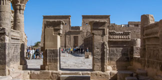 Temple of Isis at Philae, Egypt Isis is associated with funeral rites, but also as the giver of life, a healer, and a protector of kings. Little wonder they represent her with a throne on her head. - Temple of Isis at Philae, Egypt - Travelure ©