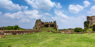 The Incredible Story of Tughlaqabad Fort, Delhi A significant feature of not just this fort, but all of Tughlaq period architecture is a wall with a massive base. The base in Tughlaqabad Fort is over 15 feet thick at places, while the top was almost dainty. - The Incredible Story of Tughlaqabad Fort, Delhi - Travelure ©