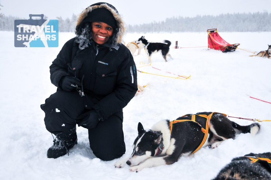 Lola with a husky, taking a break in sledding! Photo from Jokkmokk, Arctic Sweden - Travelure ©