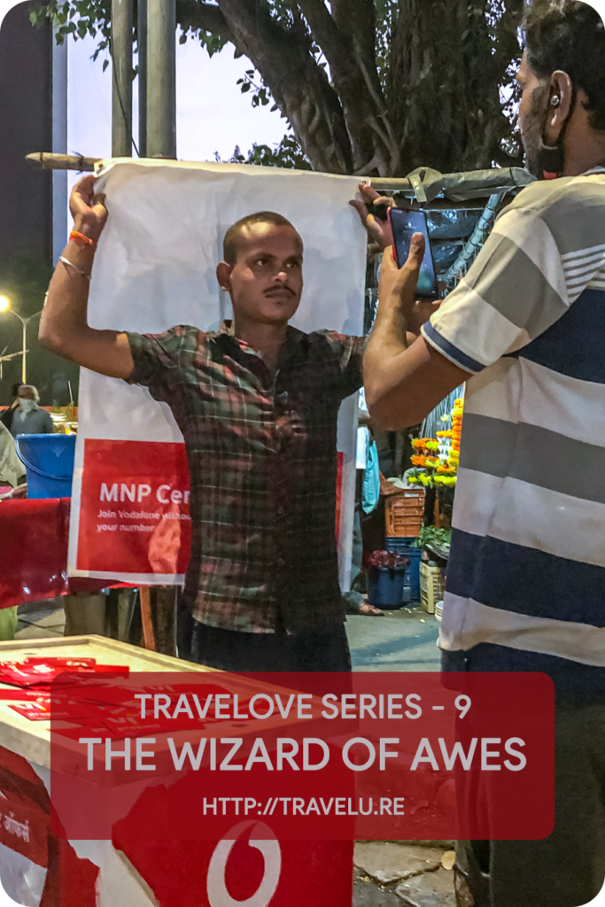 This masked superhero was a seasoned multitasker. When I approached him, he was setting up connectivity for a couple of other folks standing around his modest establishment. - Travelove Series 9 - The Wizard of Awes - Travelure ©