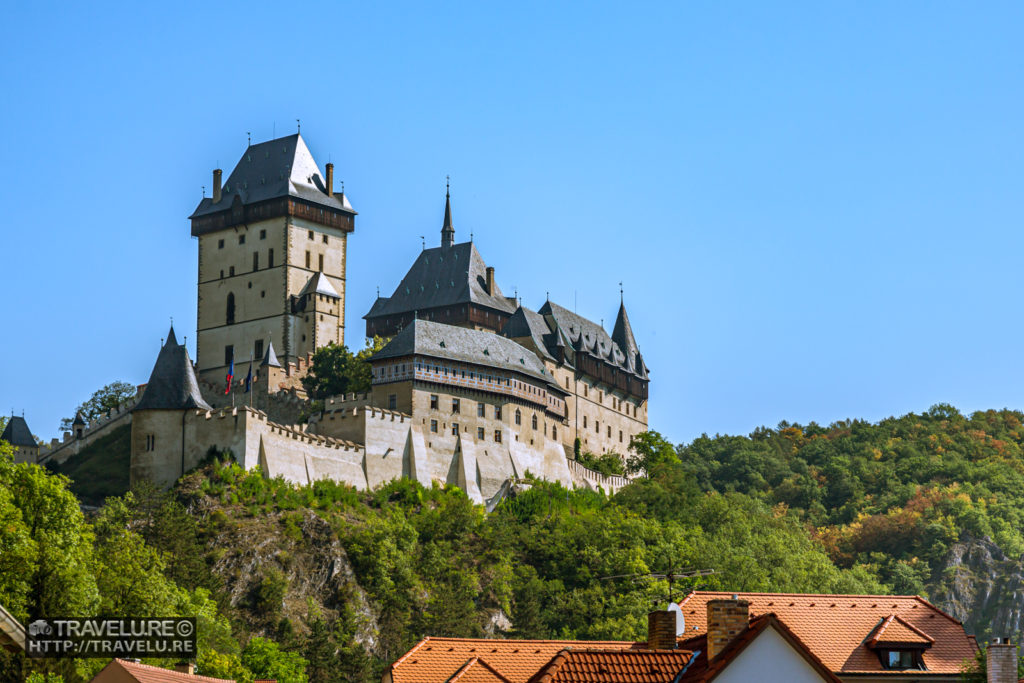 Karlstejn Castle, as seen from the village beneath - Travelure ©