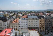 Opava – A Czech Town with its own Solar System Just in front of the town hall, a round stone ball lies in the centre of a fountain. This 230-cm ball represents the sun. - Opava - A Czech Town with its own Solar System - Travelure ©