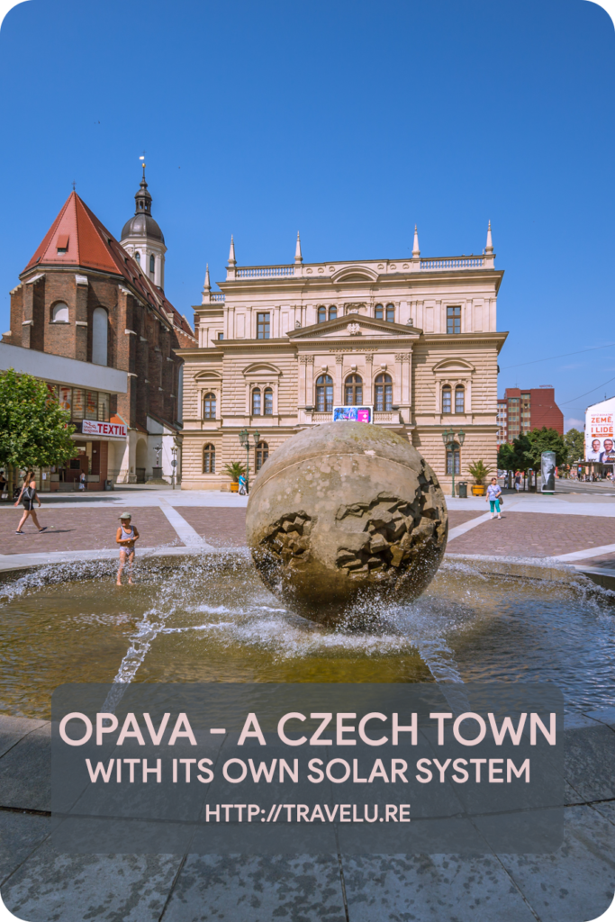 Just in front of the town hall, a round stone ball lies in the centre of a fountain. This 230-cm ball represents the sun. - Opava - A Czech Town with its own Solar System - Travelure ©