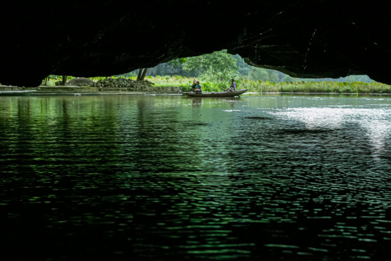 About 20 minutes into the ride we found ourselves ducking under as our boat passed through a cave. - Tam Coc, Ninh Binh - Vietnam’s Inland Ha Long Bay - Travelure ©