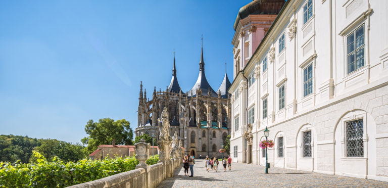 The bright reds, sparkling greens, hues of blues, and rich purples impart the stained glass windows, exquisite vibrance. - St Barbara Church, Kutna Hora - Central Europe’s Architectural Beacon - Travelure ©
