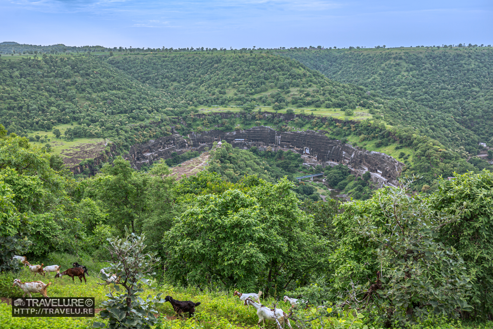Ajanta Caves horseshoe gorge viewed from above, surrounded by monsoon forest, Maharashtra